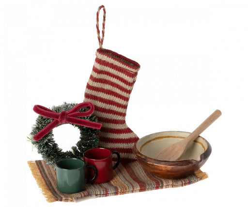 festive wreath, stocking, cups, rug, bowl and a wooden spoon