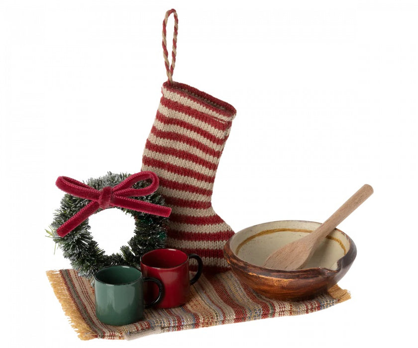 festive wreath, stocking, cups, rug, bowl and a wooden spoon