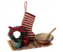 festive wreath, stocking, cups, rug, bowl and a wooden spoon