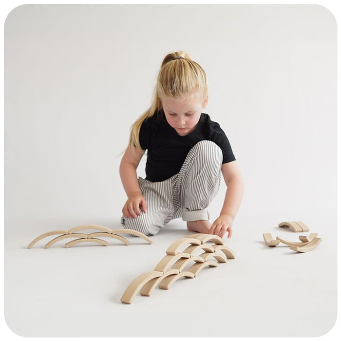 A child playing with Abel Blocks Mini 72 REWOOD