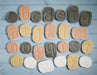 Tactile stones with lowercase letters carved on them to trace on