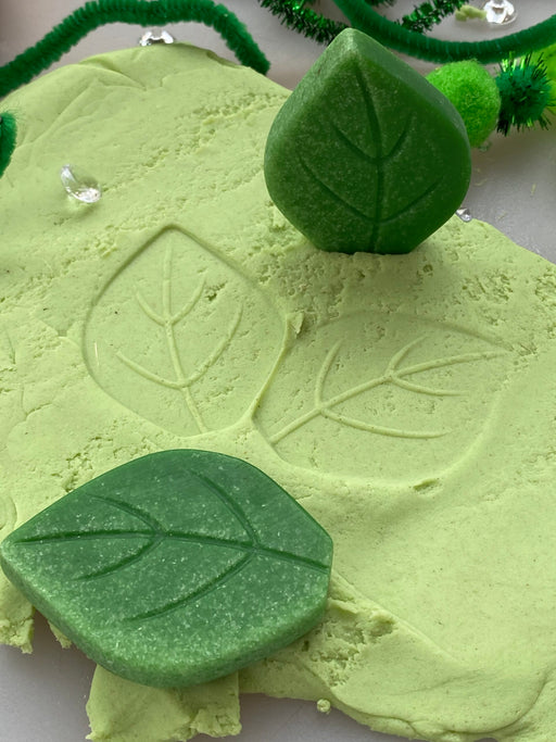 Leaf stone imprints on play dough