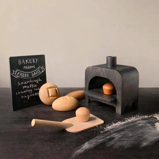 Play set with a black brick oven, breads and muffins