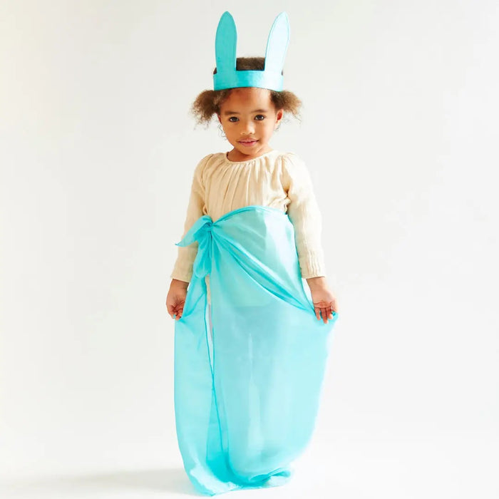 A child wearing Peacock Bunny Ears and matching silk wrapped around the waist