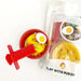 Play dough kit including a Melamine bowl, noodle extruder, chopsticks with chopstick trainer, dumpling charm, egg charm, chili sauce charm, green onion fimo, and fish cake fimo.