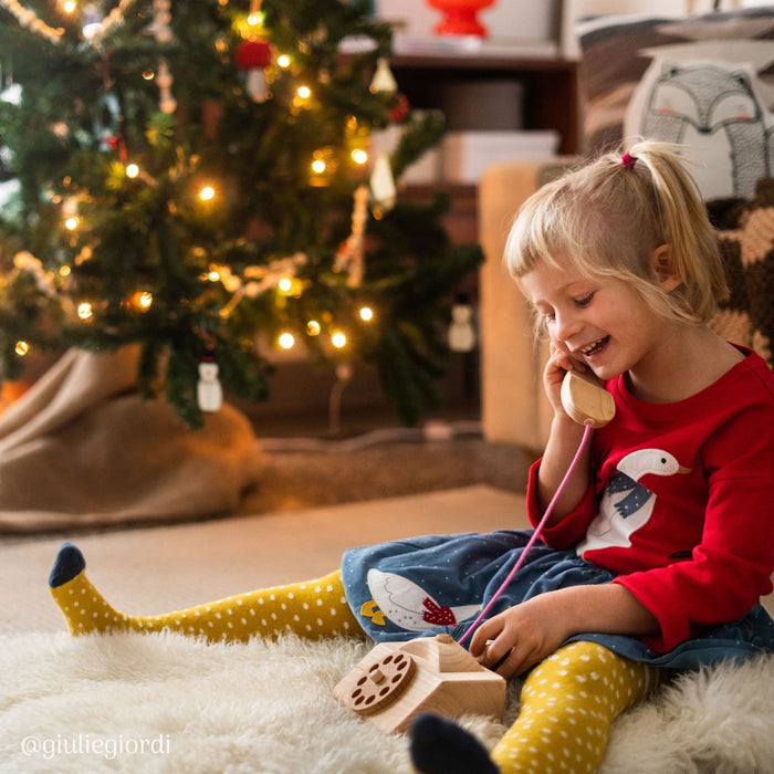 A child playing with the telephone