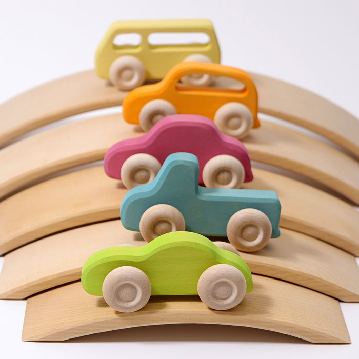 Grimms Wooden Slimeline cars in pastel colors on natural wooden brights