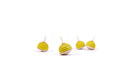 5 yellow wooden spinning tops that have black stripes like a bumble bee