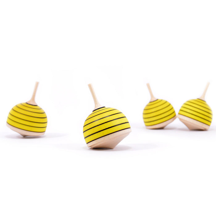 yellow and black wooden spinning top that is painted to look like a bee